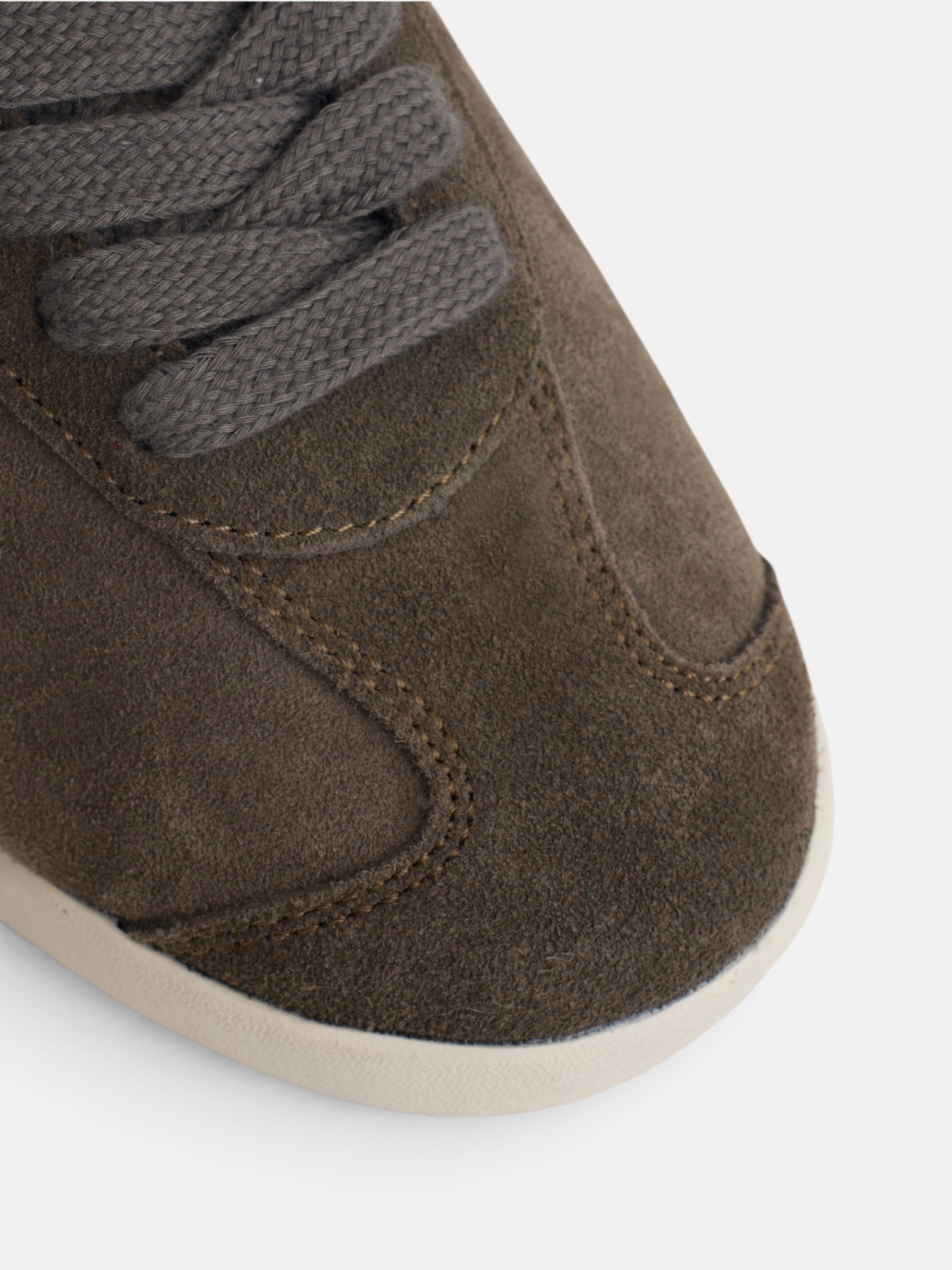 Brown suede sneaker with perforated logo
