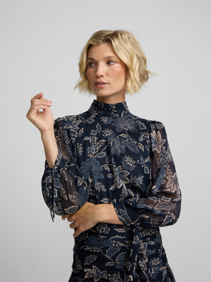 Blue floral print blouse with tied sleeves