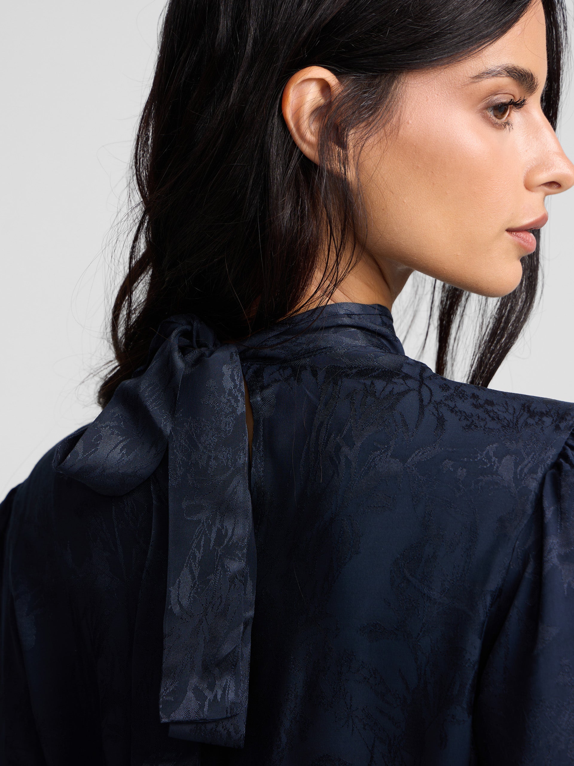 Blue jacquard neck strap blouse