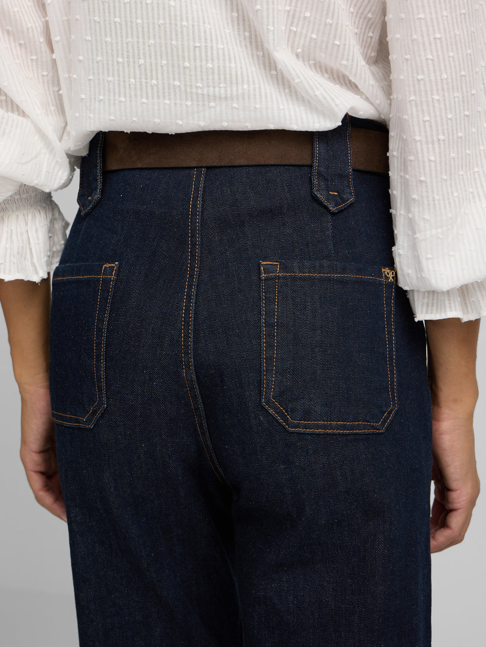 Straight denim trousers with buckle details denim