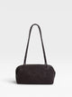 Elongated braided brown leather shoulder bag