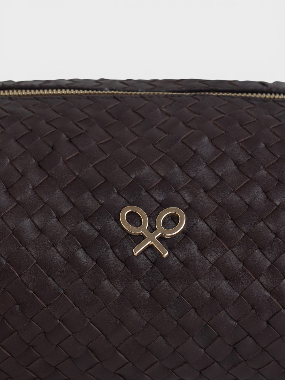 Elongated braided brown leather shoulder bag
