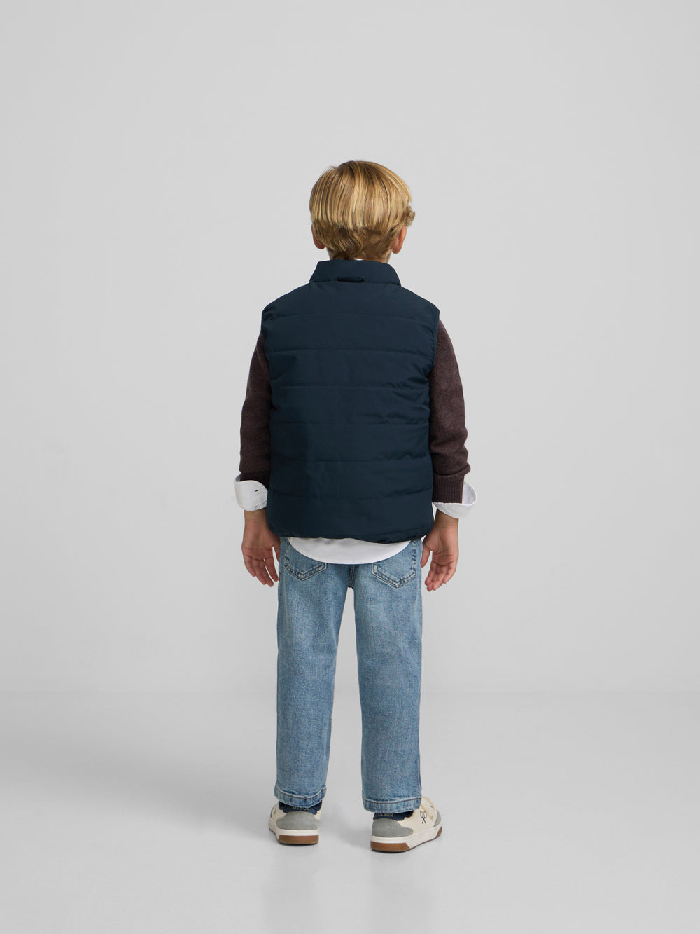 Kids reversible vest with navy green pockets