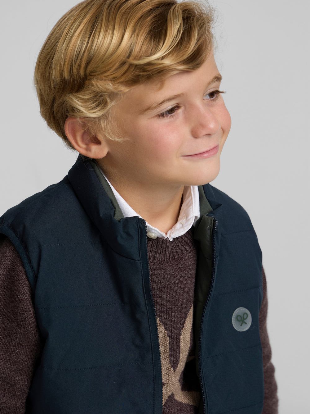 Kids reversible vest with navy green pockets