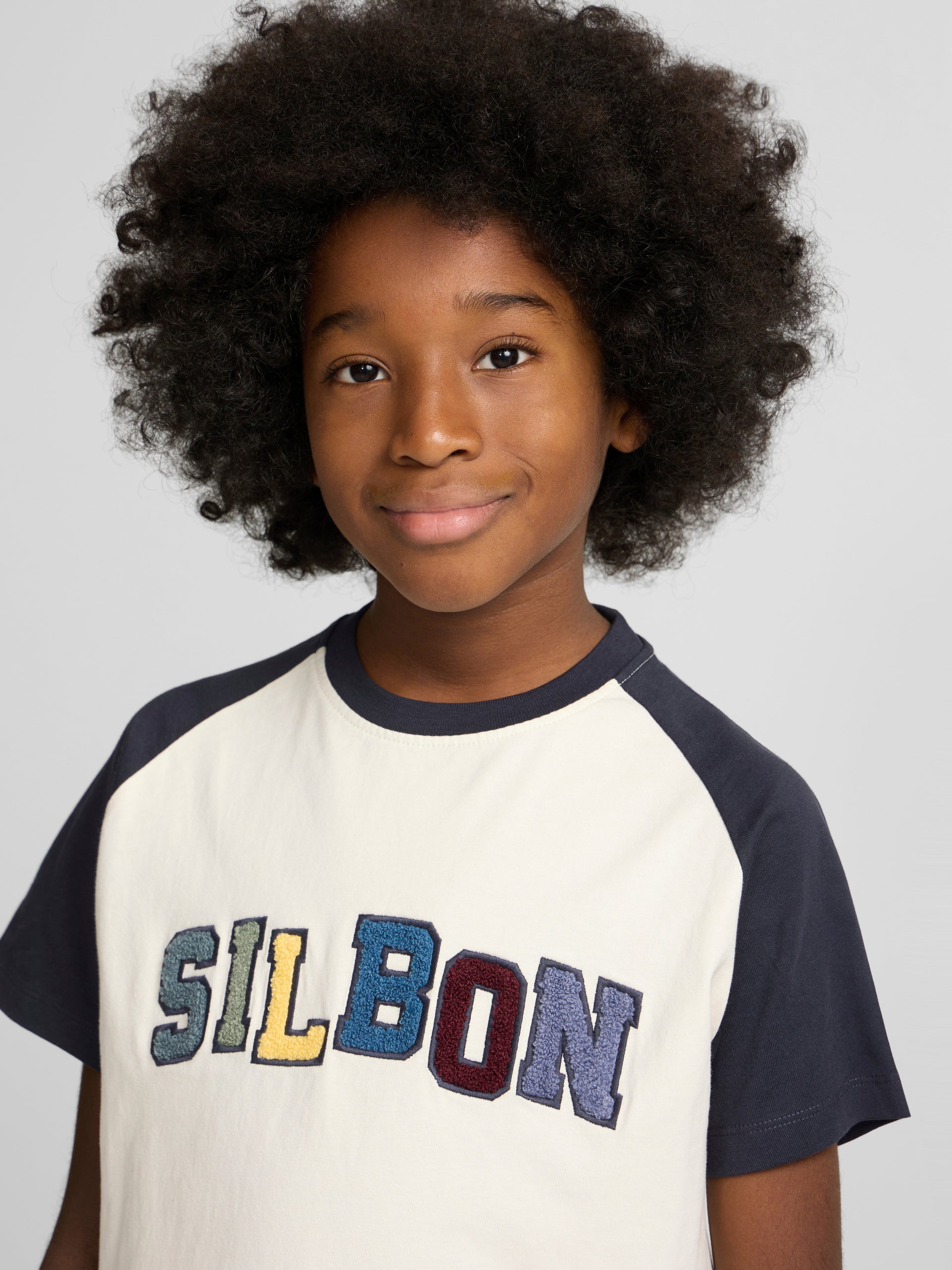 Camiseta kids ranglan varsity azul marino