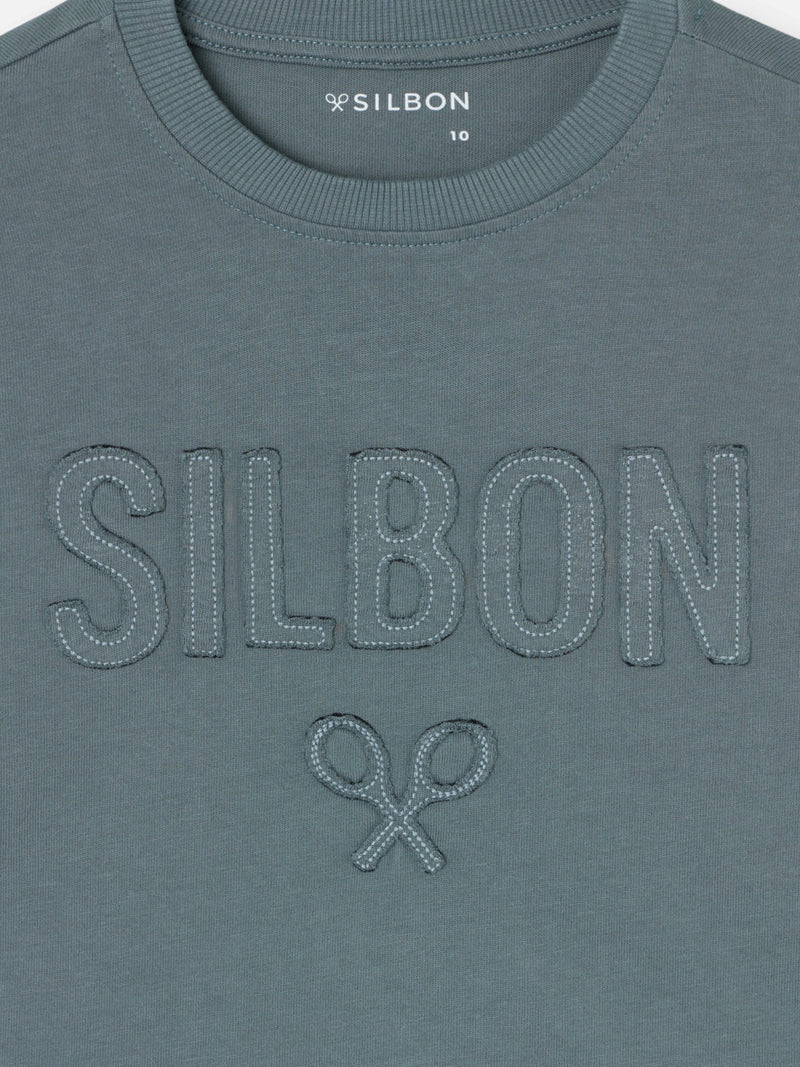 Camiseta kids silbon patch tono verde oscuro