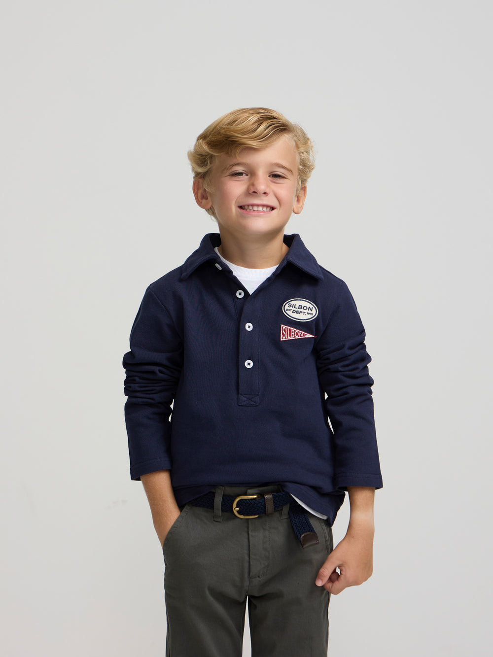 Polo criança com emblemas azul-marinho