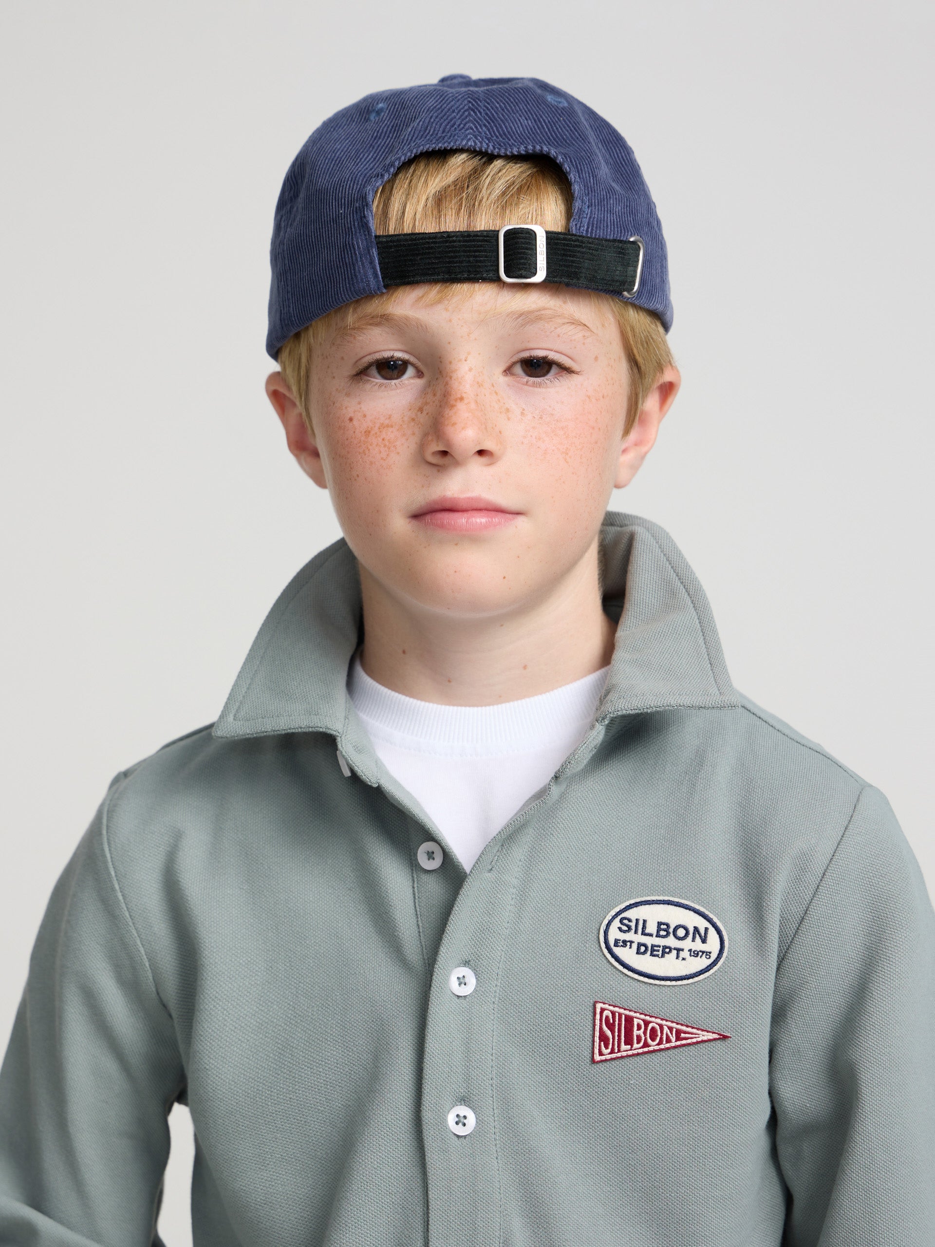 Polo enfant vert à patchs
