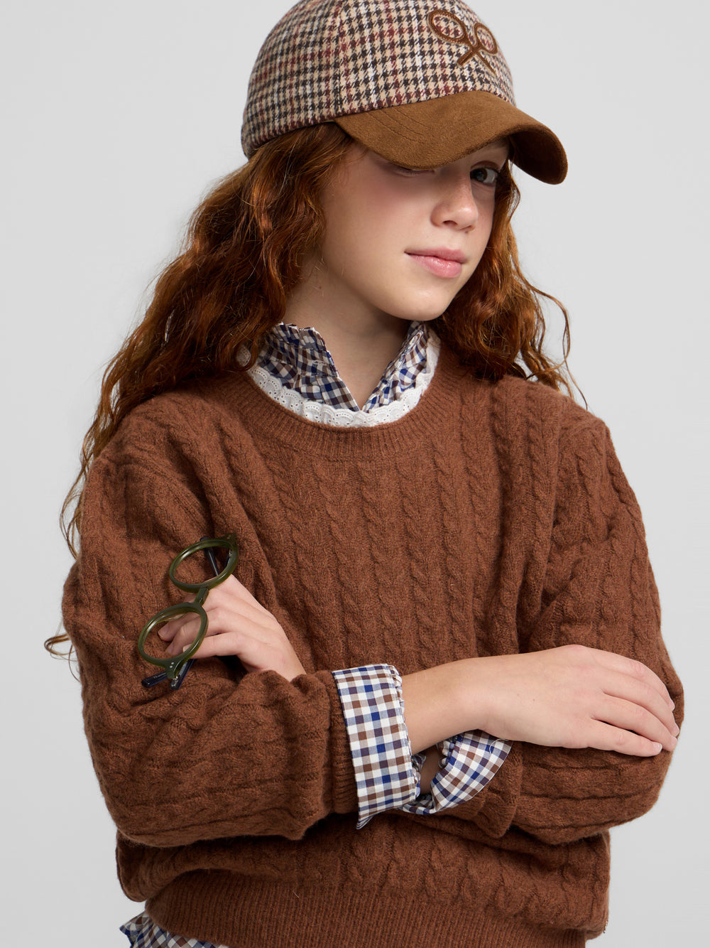 Brown cable knit girl's sweater with ruffled collar