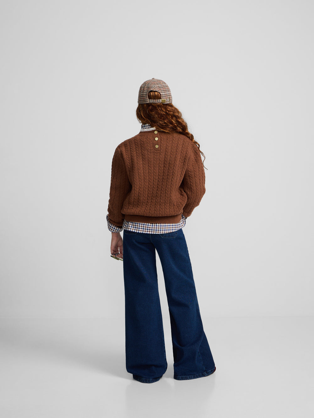 Brown cable knit girl's sweater with ruffled collar