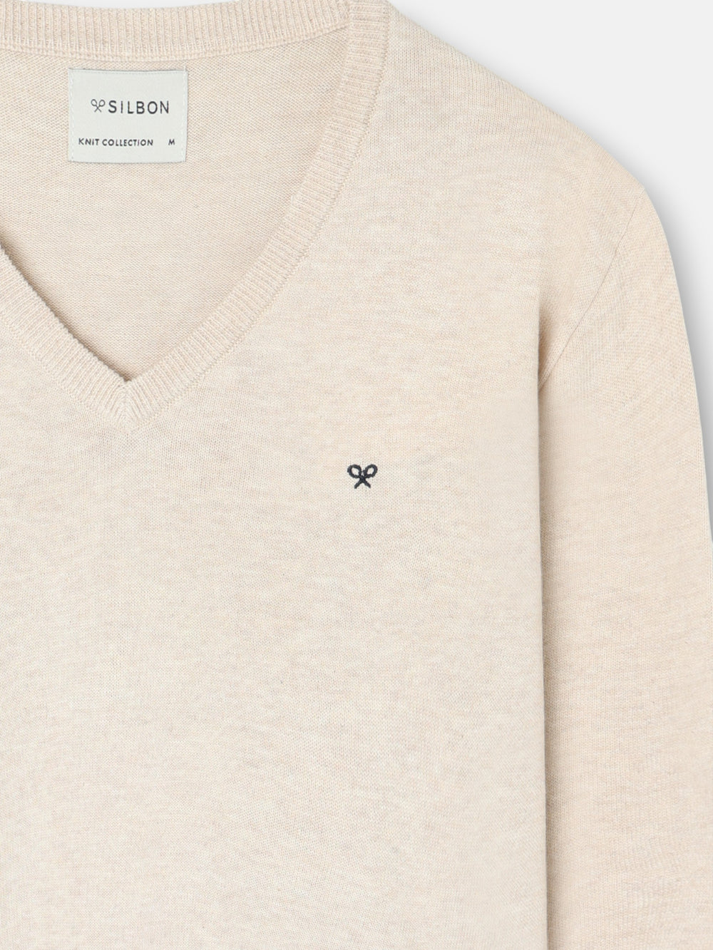 Jersey liso cuello pico crema