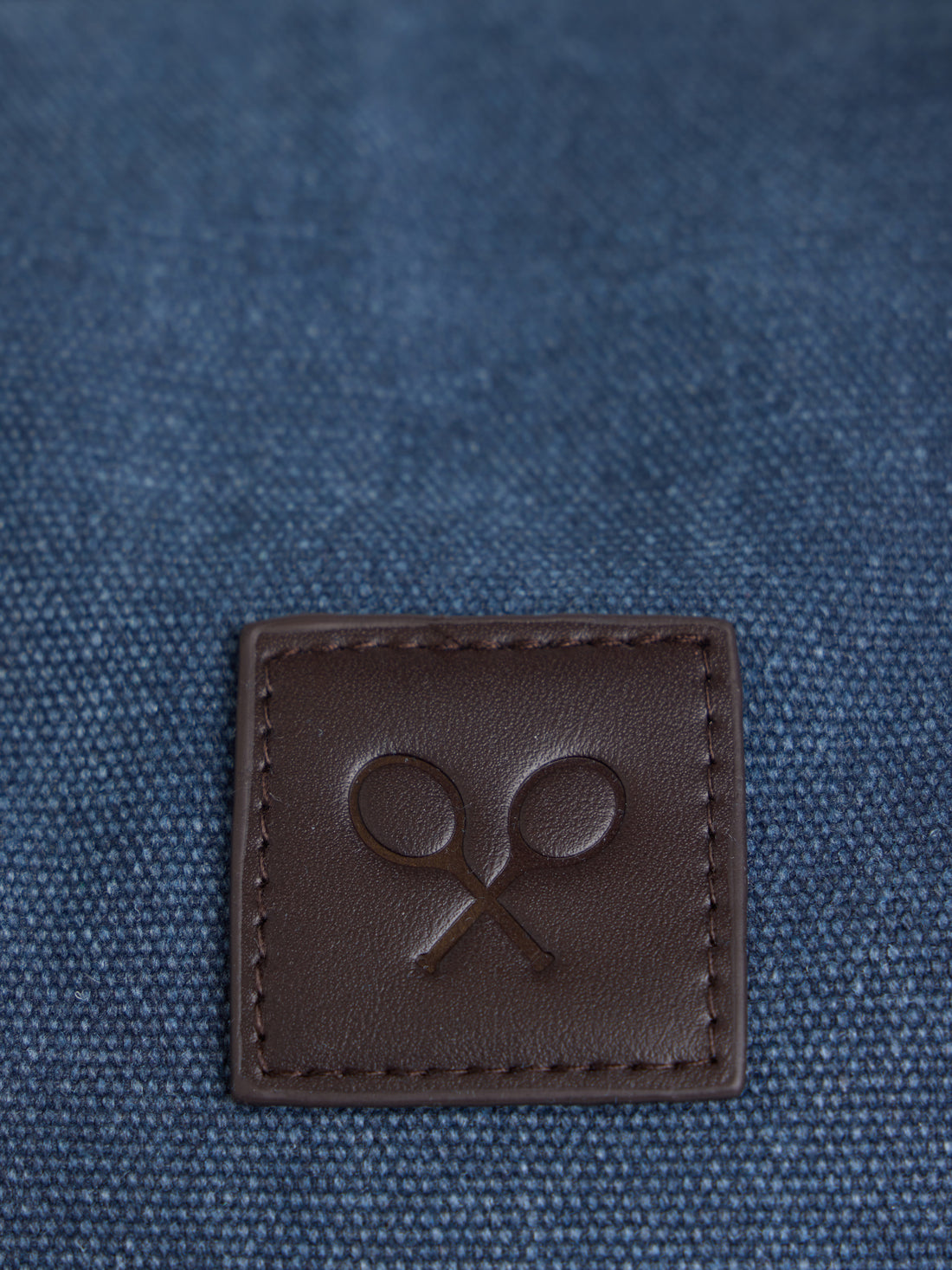 Navy blue travel bag with leather detail