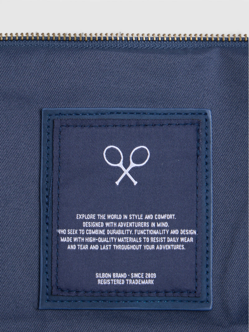 Navy blue travel bag with leather detail