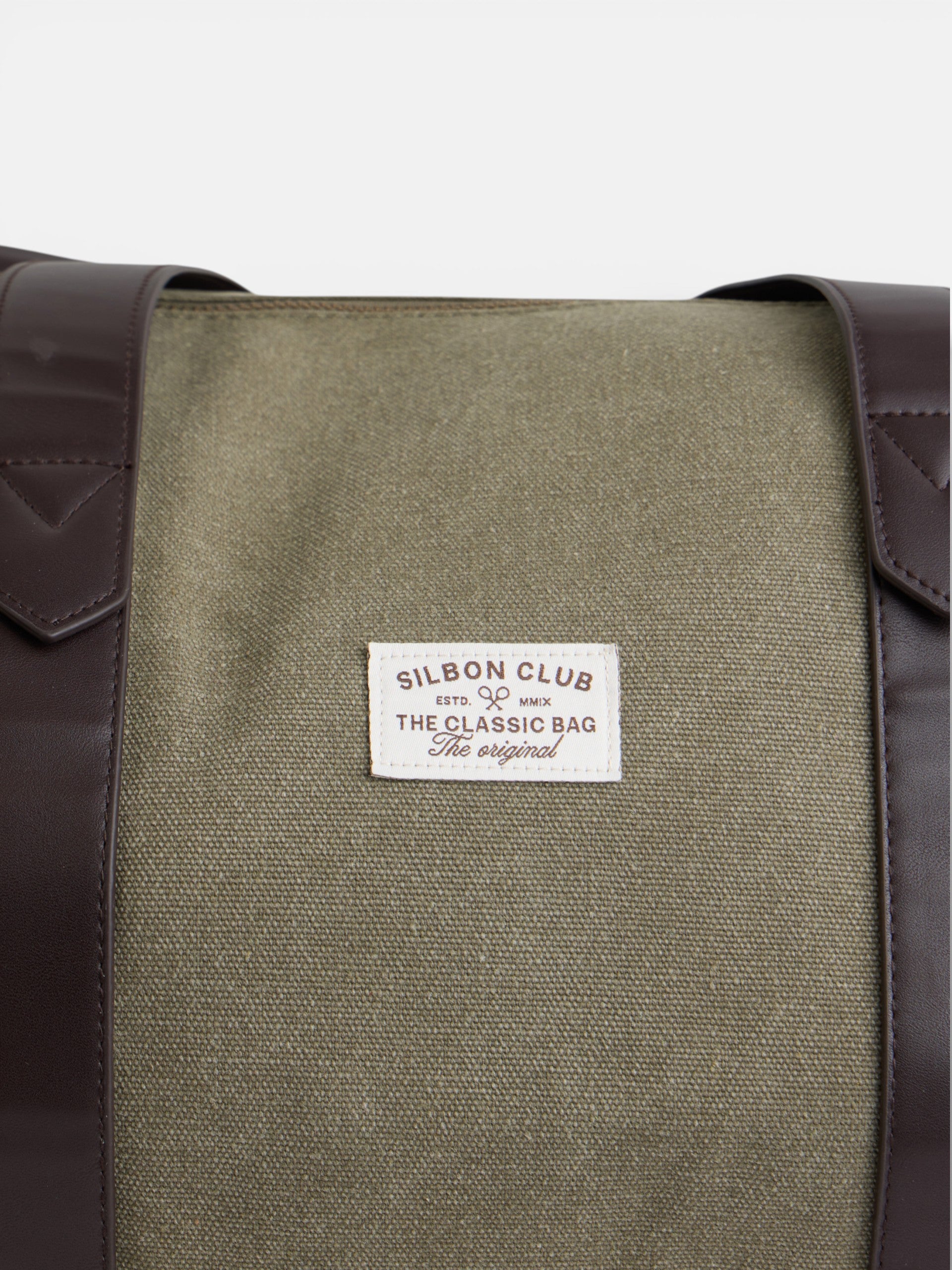 Mala de viagem com detalhe em pele verde