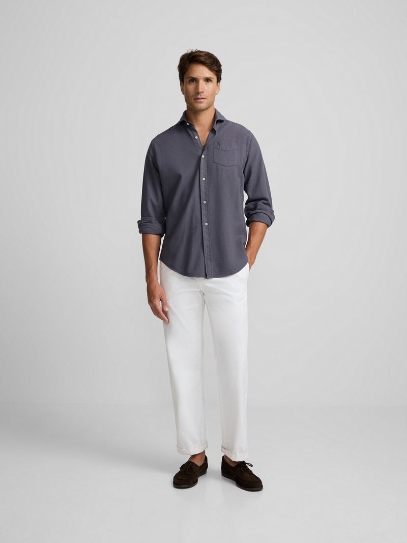Chemise sport bleue à poche usée