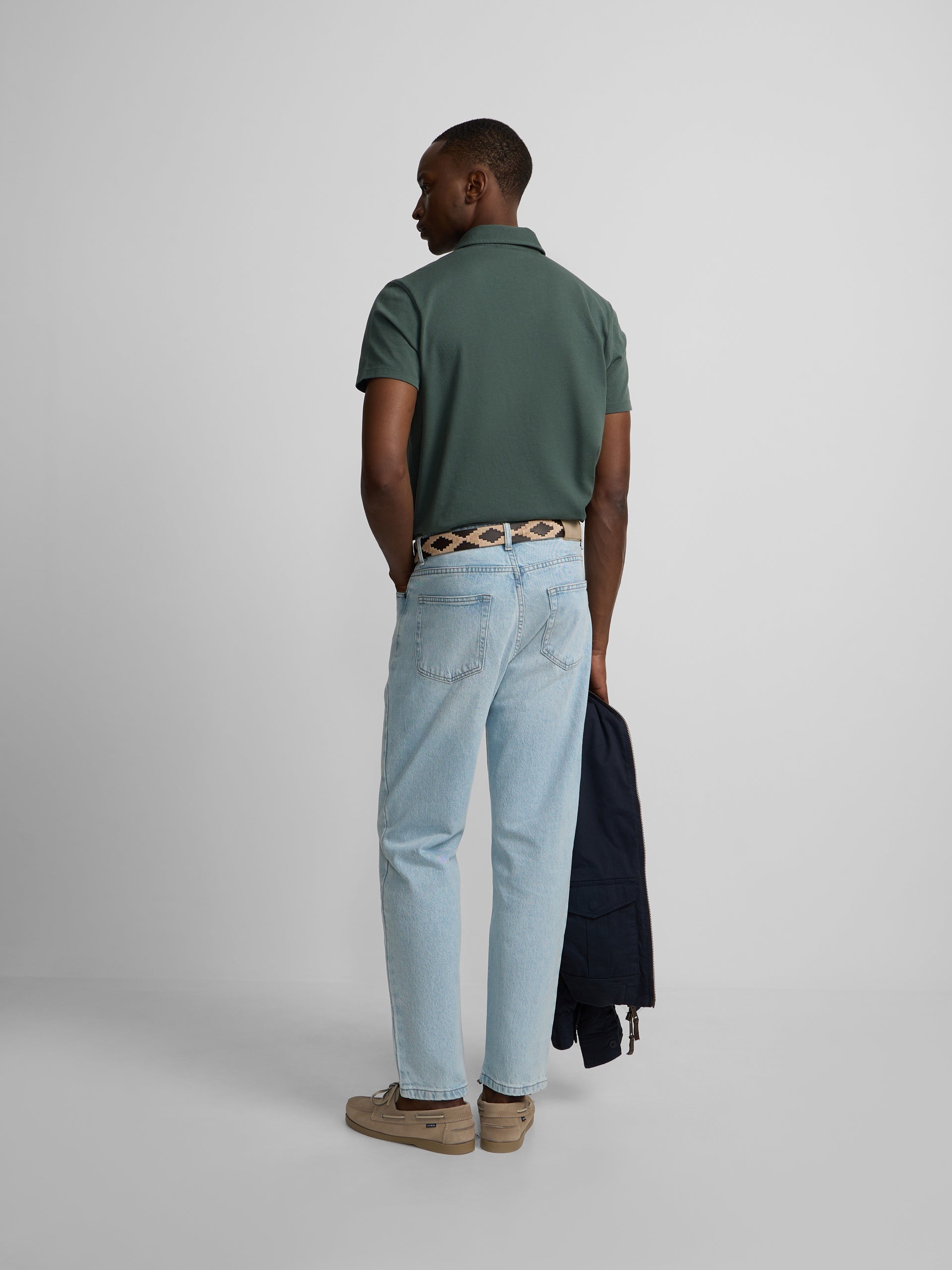 Short-sleeved polo with embossed green logo
