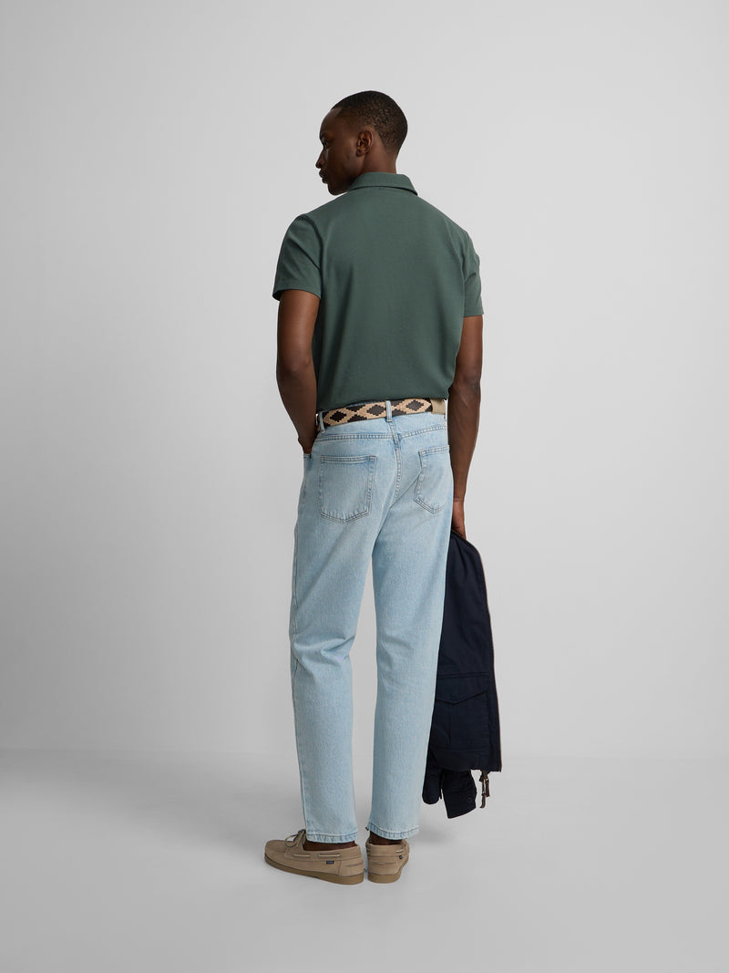 Short-sleeved polo with embossed green logo