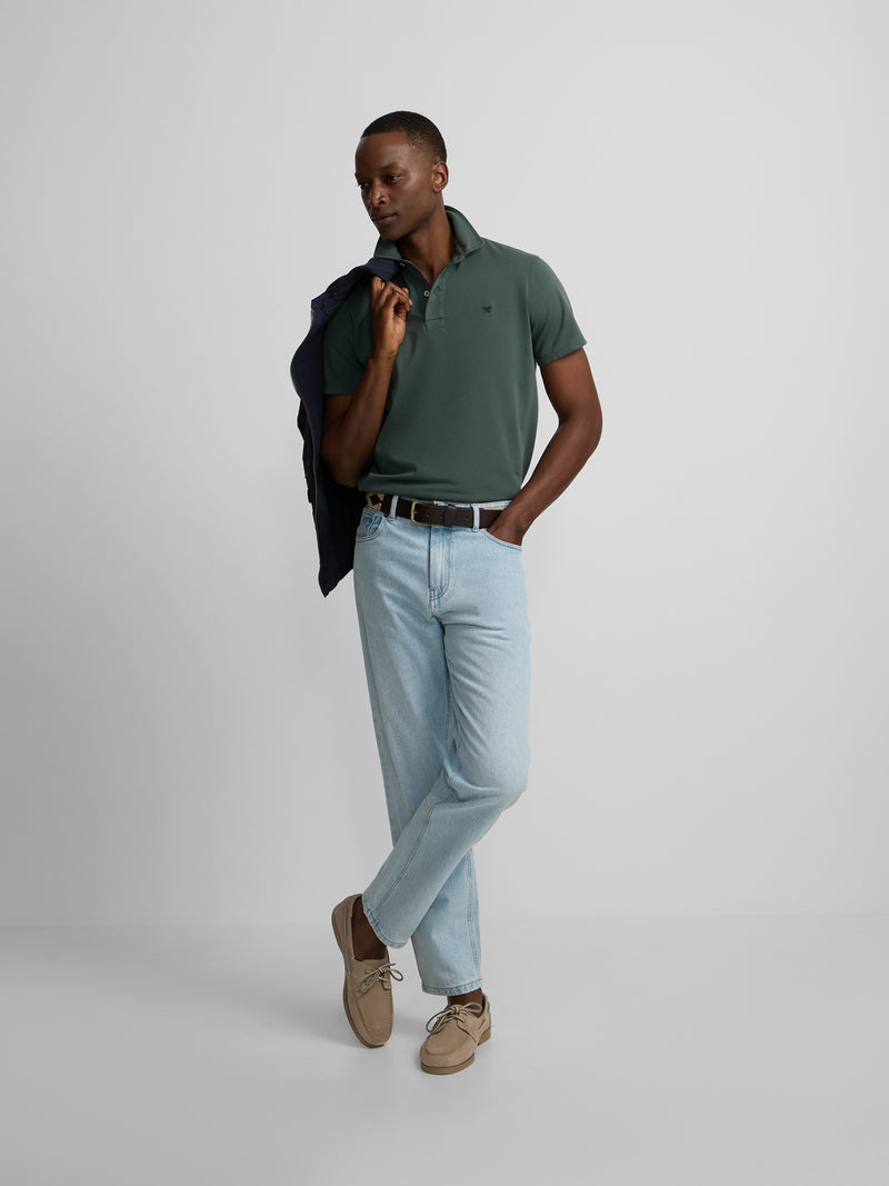 Short-sleeved polo with embossed green logo