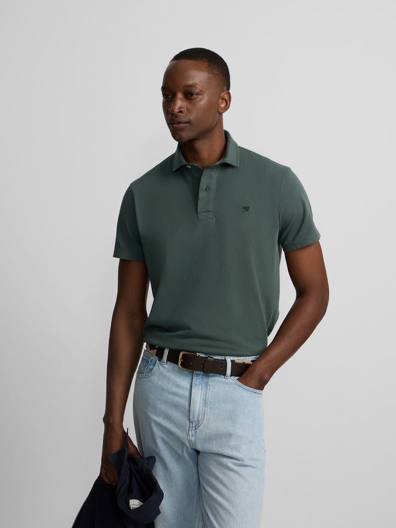 Short-sleeved polo with embossed green logo