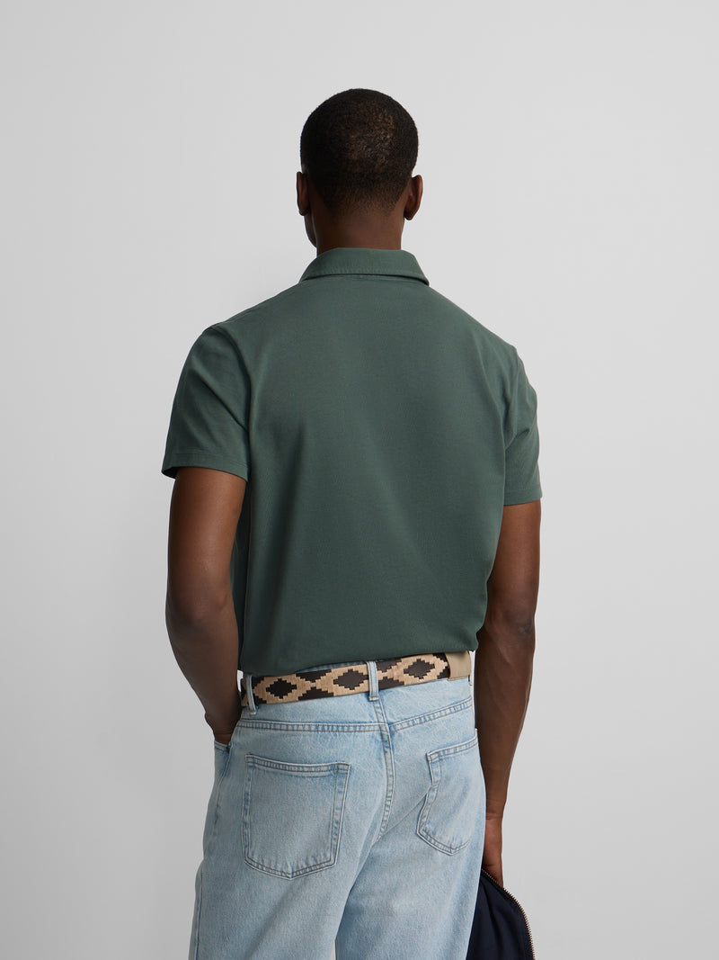 Short-sleeved polo with embossed green logo