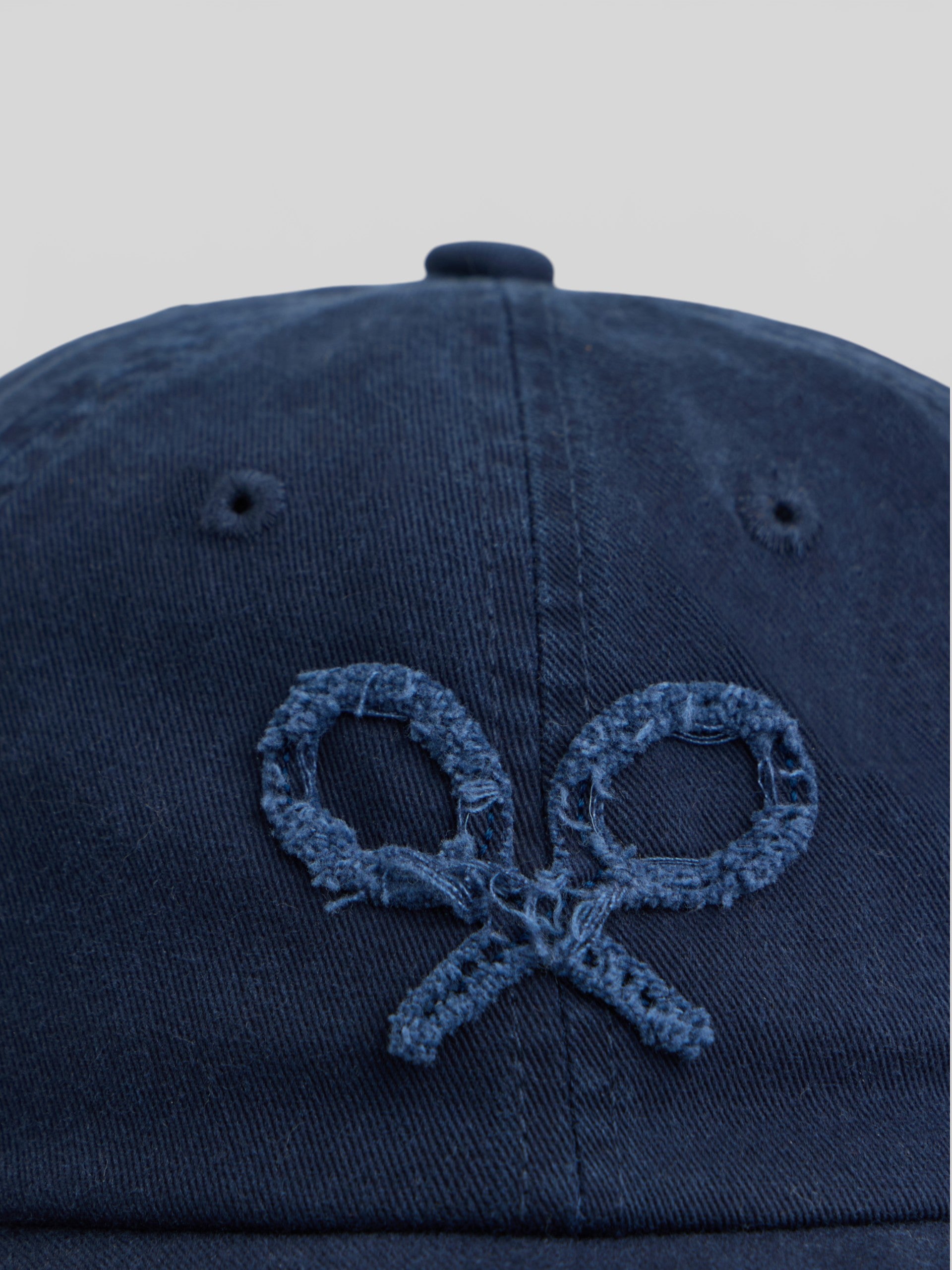 Navy blue embossed racket cap