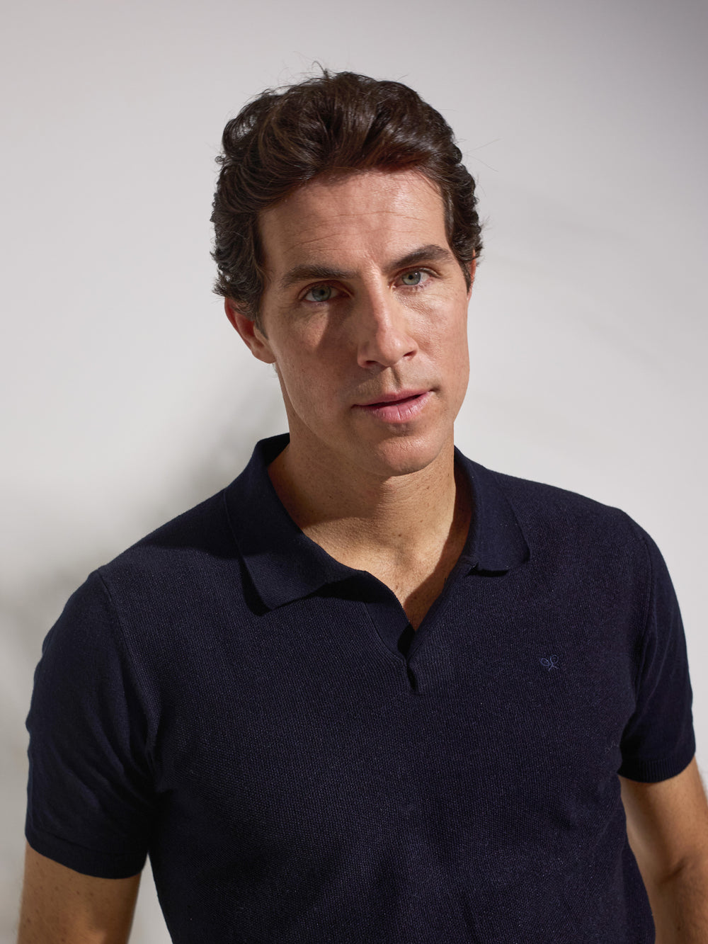 Polo unique estructura azul marino