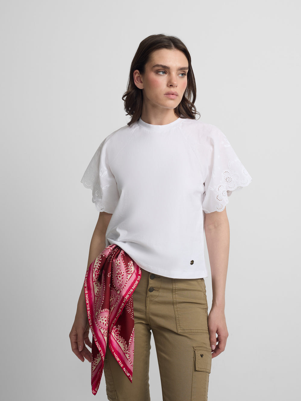 Women's white t-shirt with embroidered ruffles