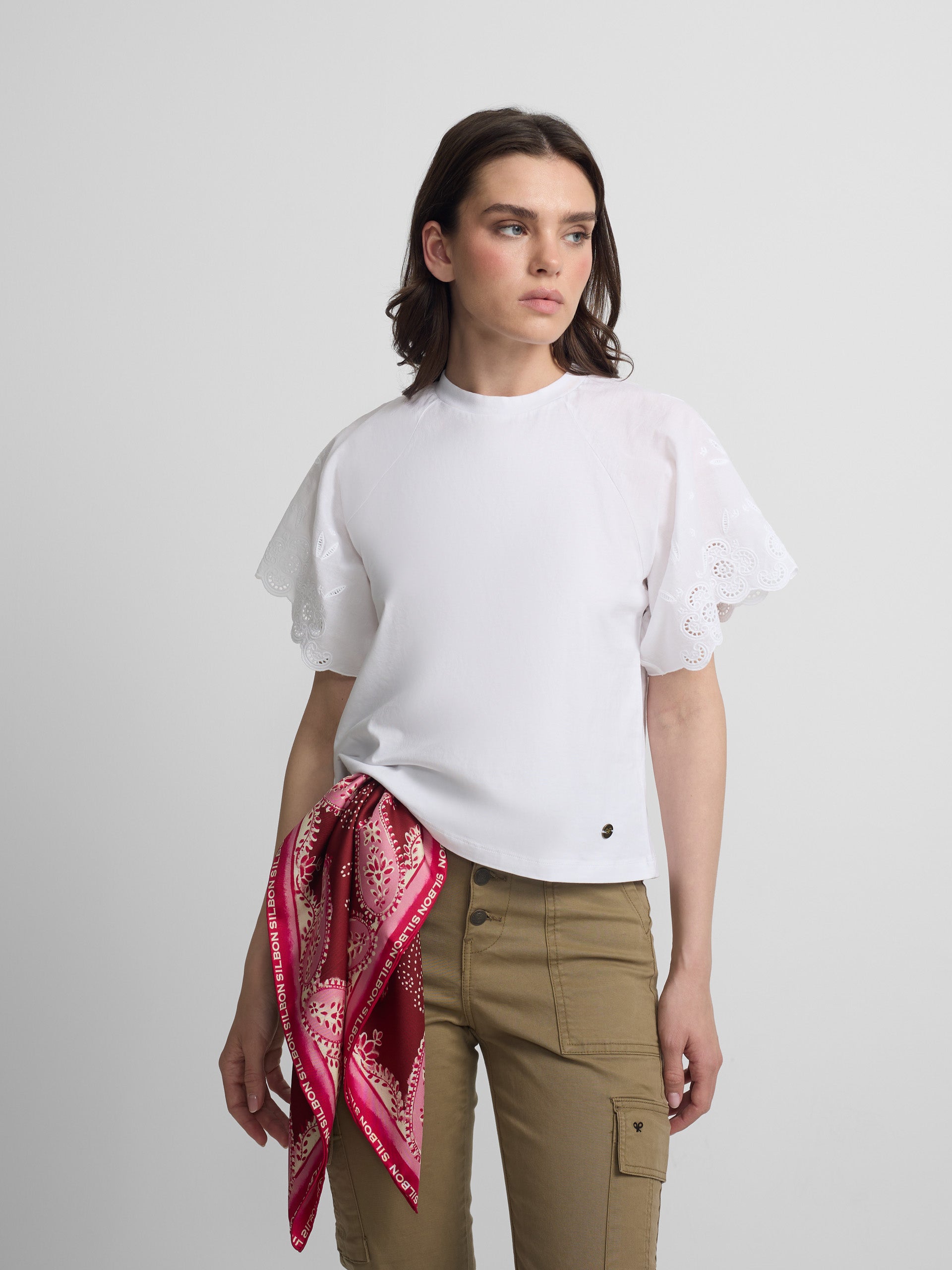 Women's white t-shirt with embroidered ruffles