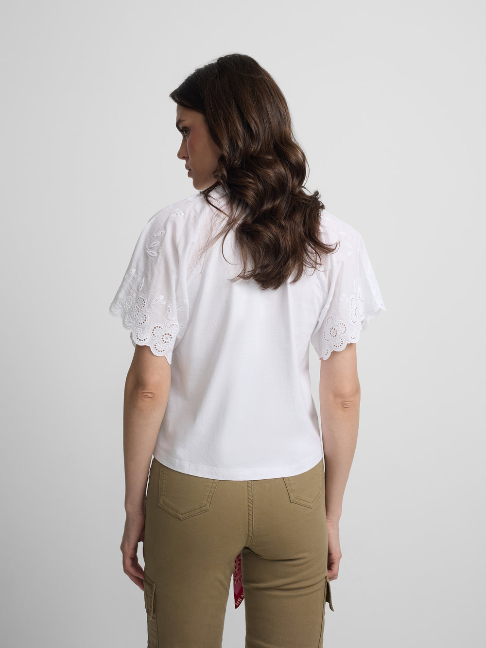Women's white t-shirt with embroidered ruffles