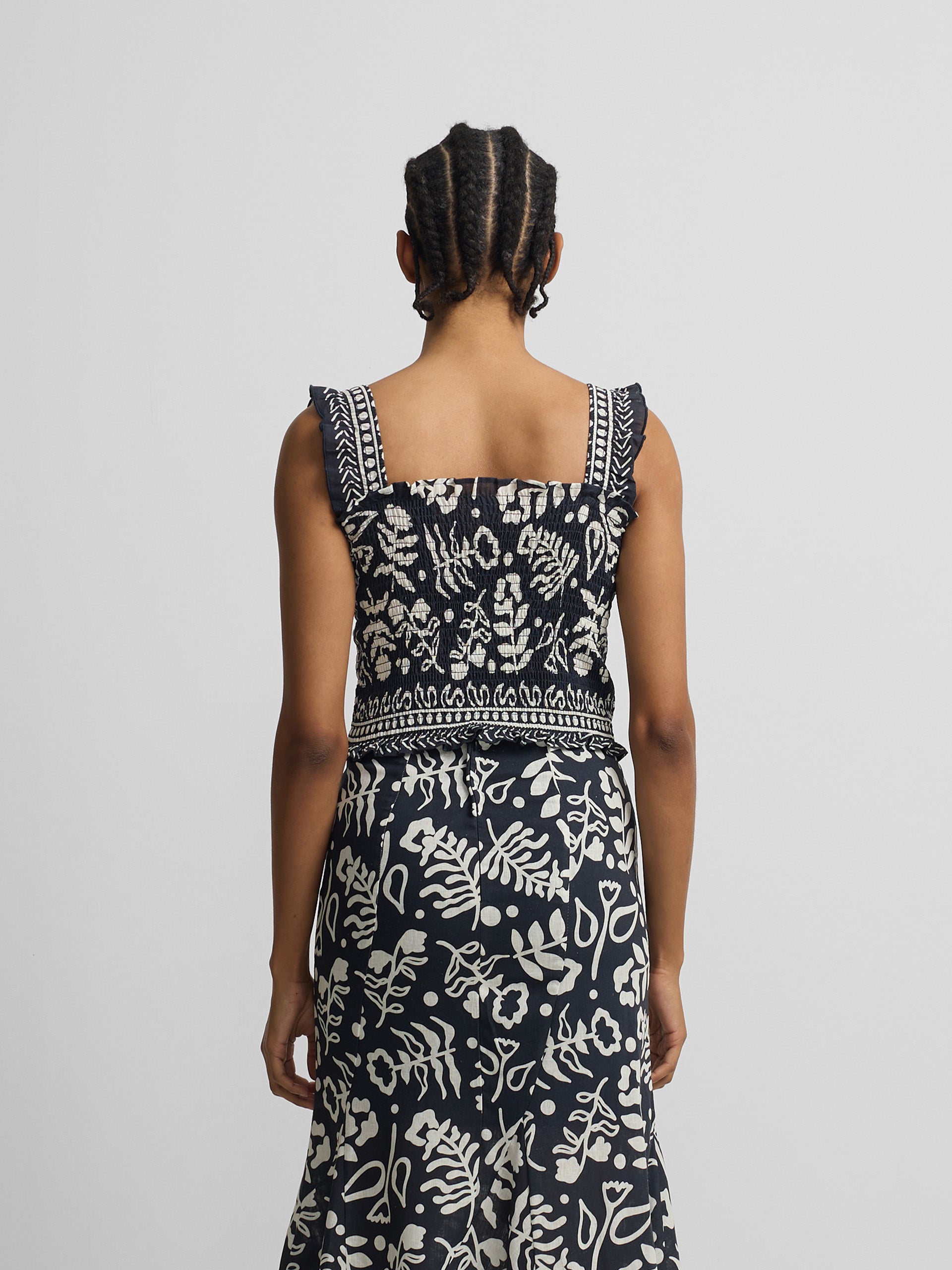 Saia fluida com folhos estampado marinho