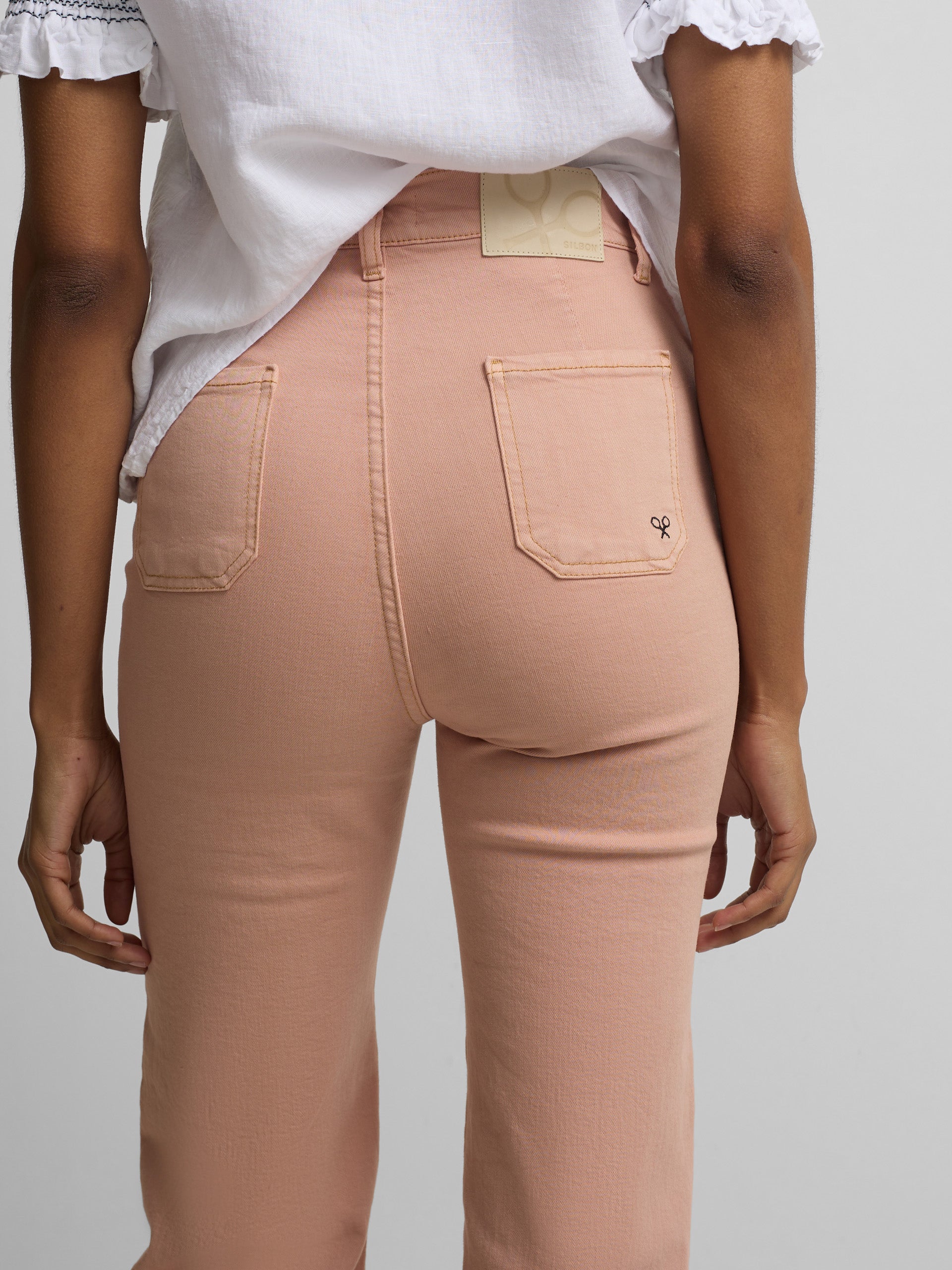 Calças de ganga com fivelas coral