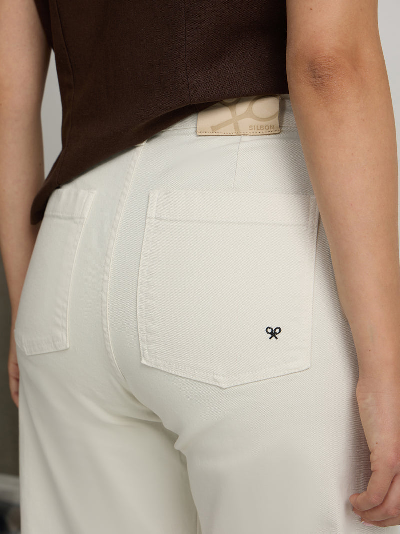 Pantalón denim crudo