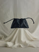 Gathered leather bag with chain detail in black