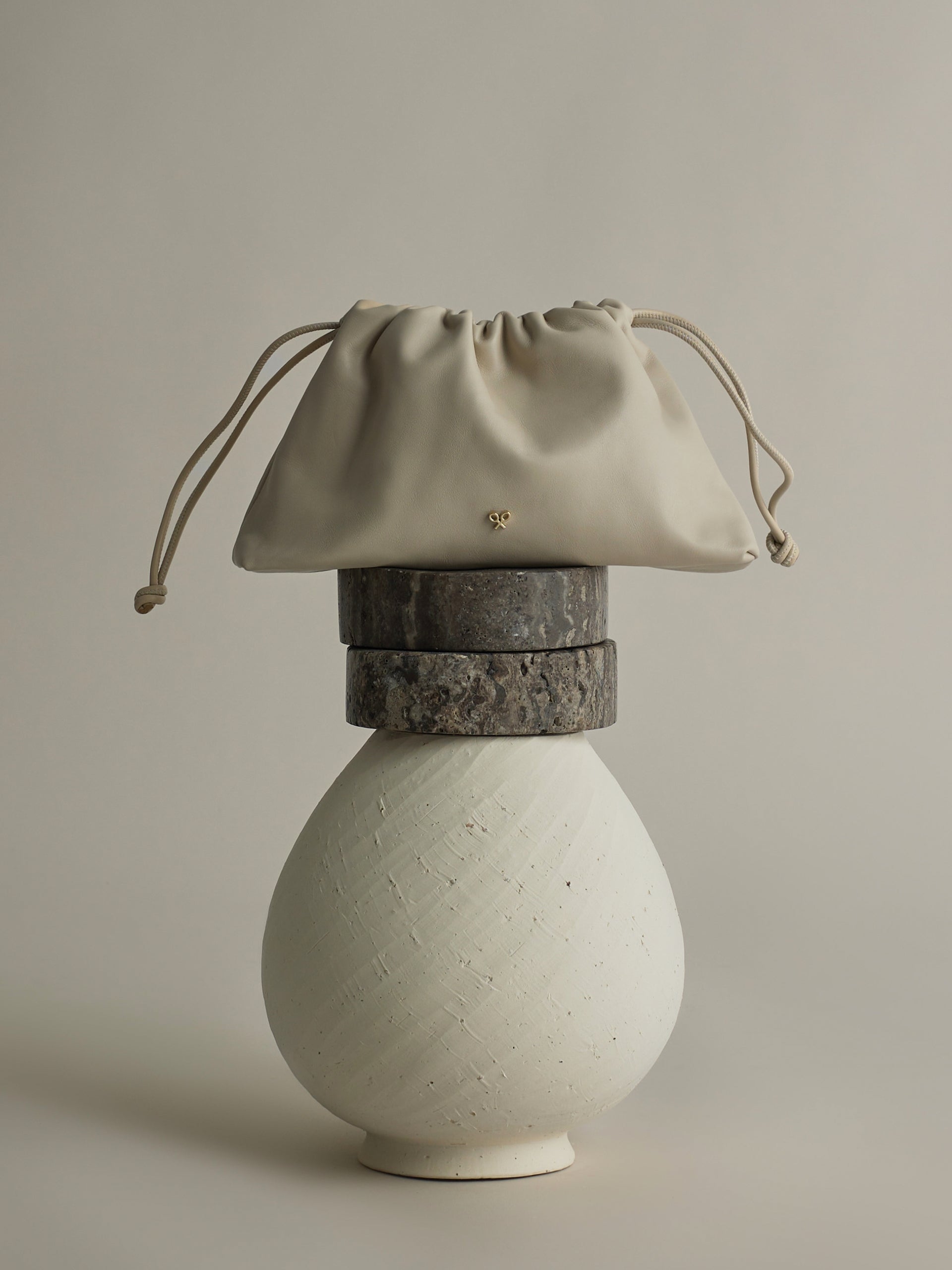 Gathered leather bag with chain detail in off-white