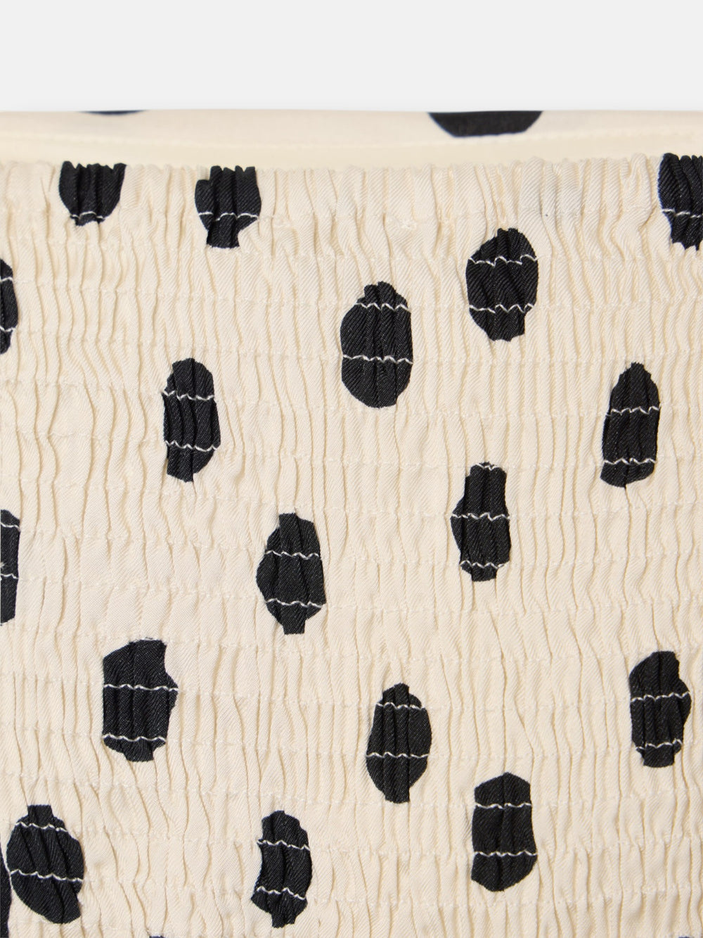 Black and white polka dot strapless top