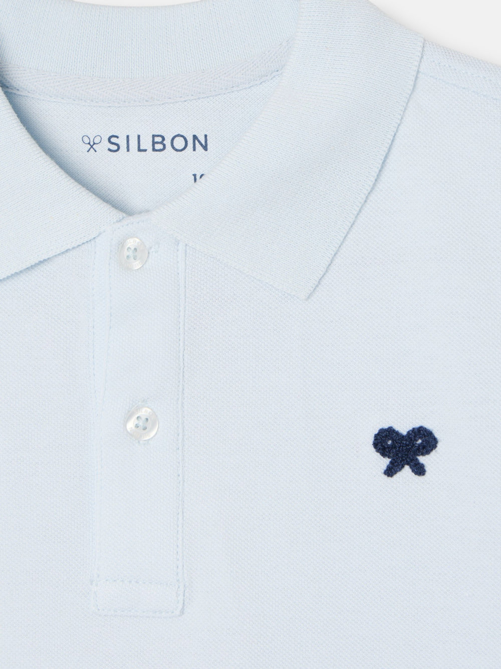 Polo kids liso logo rizo azul claro