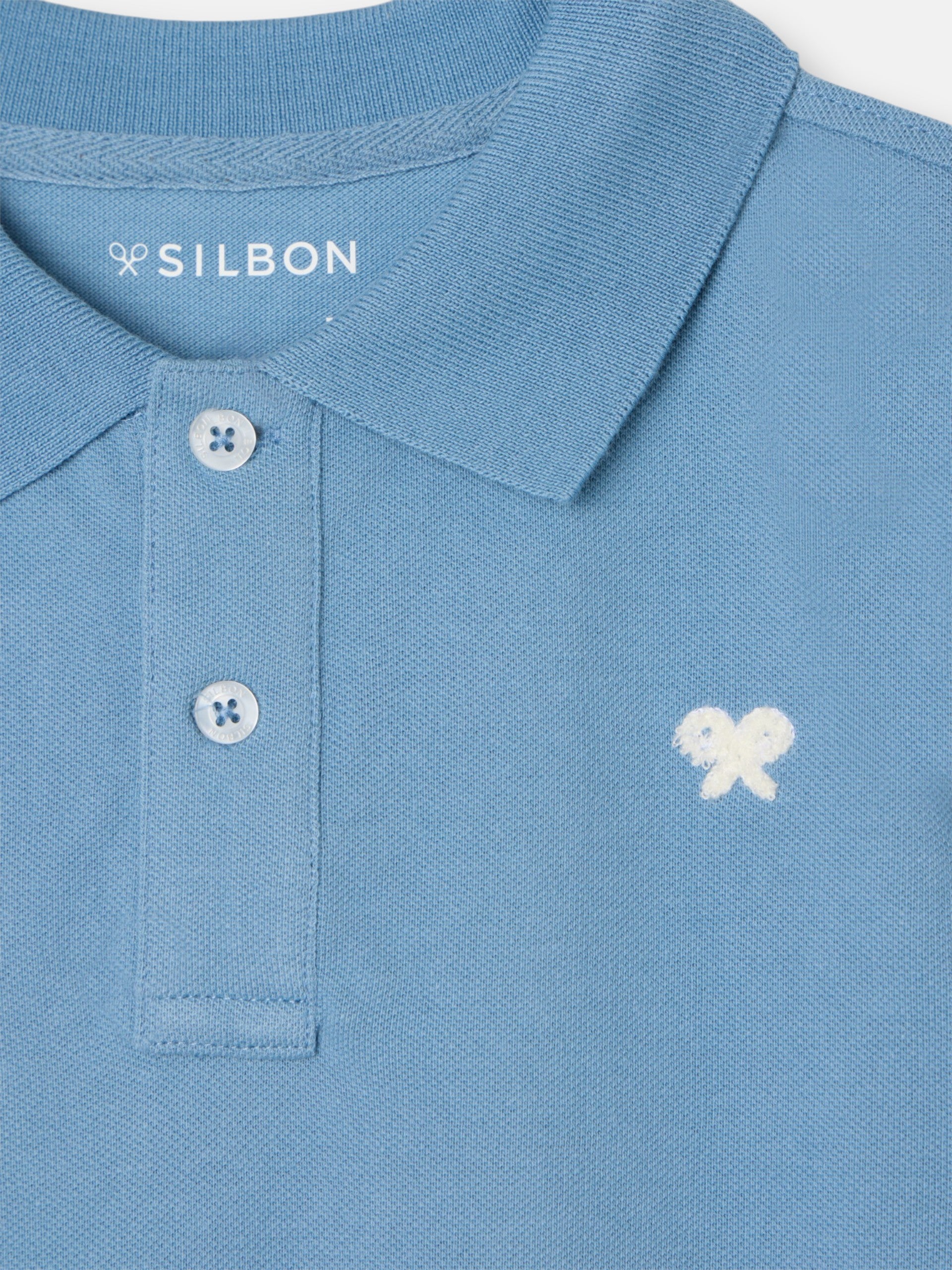 Polo kids liso logo rizo azul medio