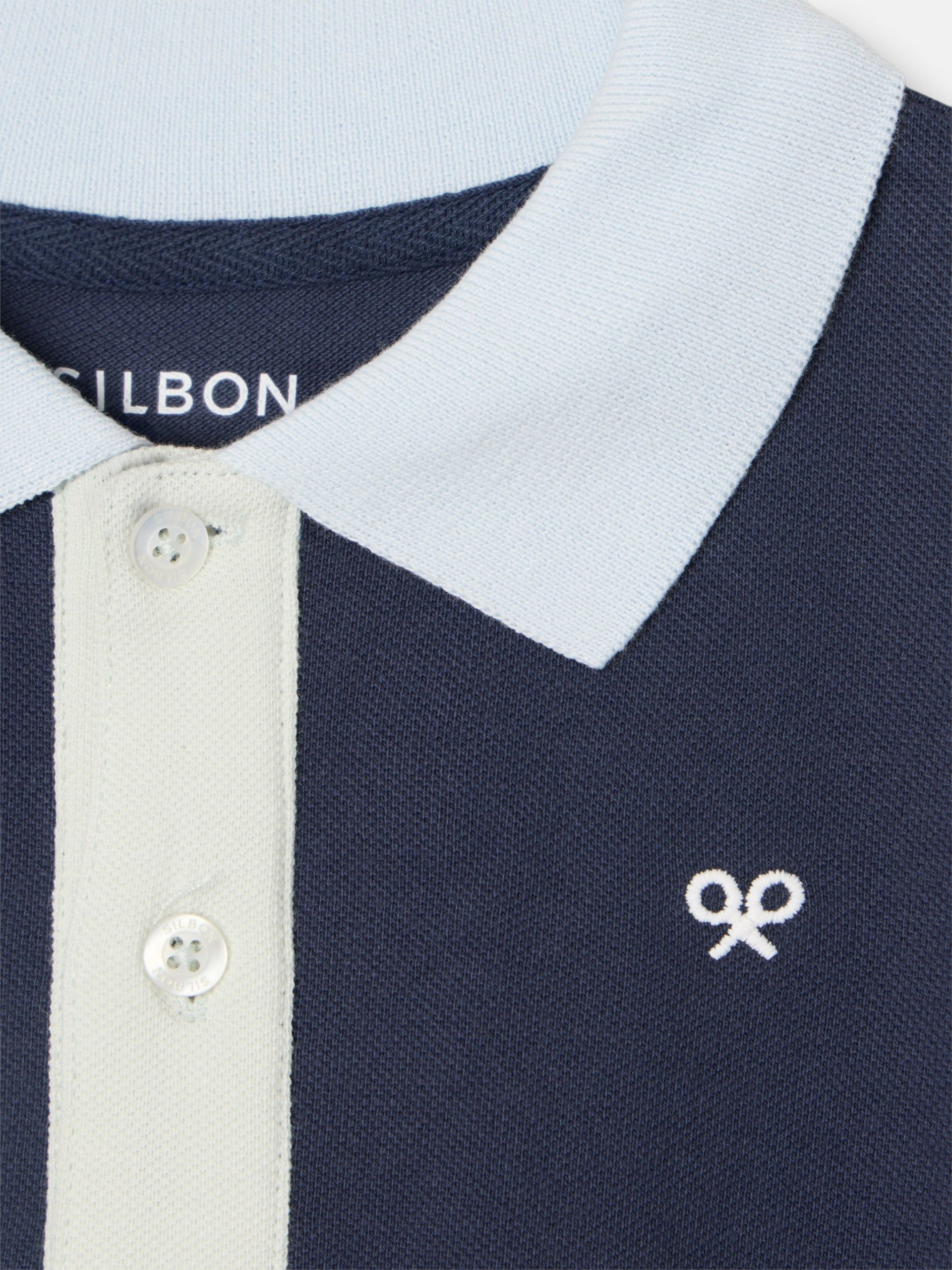 Navy blue kids polo with multicolor trim
