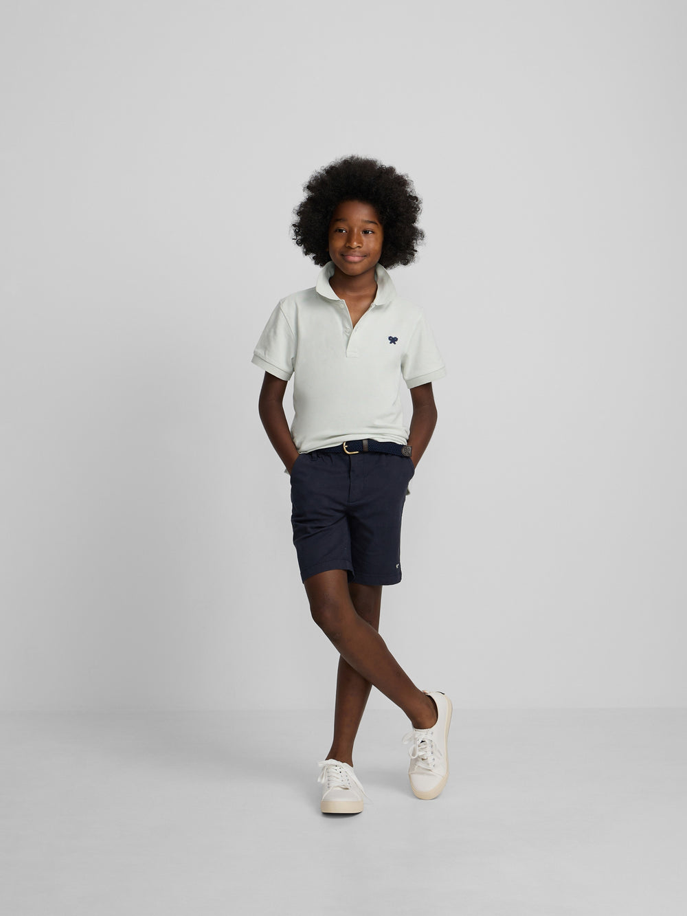 Polo enfant uni logo bouclé vert clair