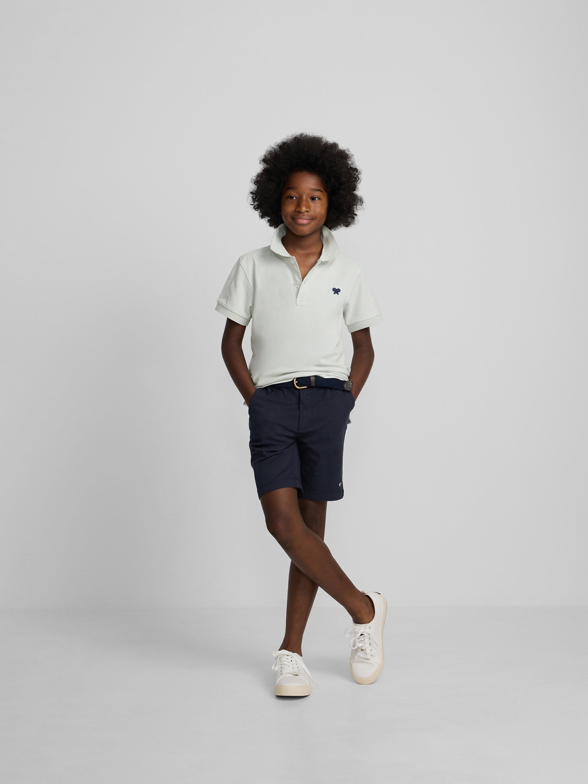 Polo enfant uni logo bouclé vert clair