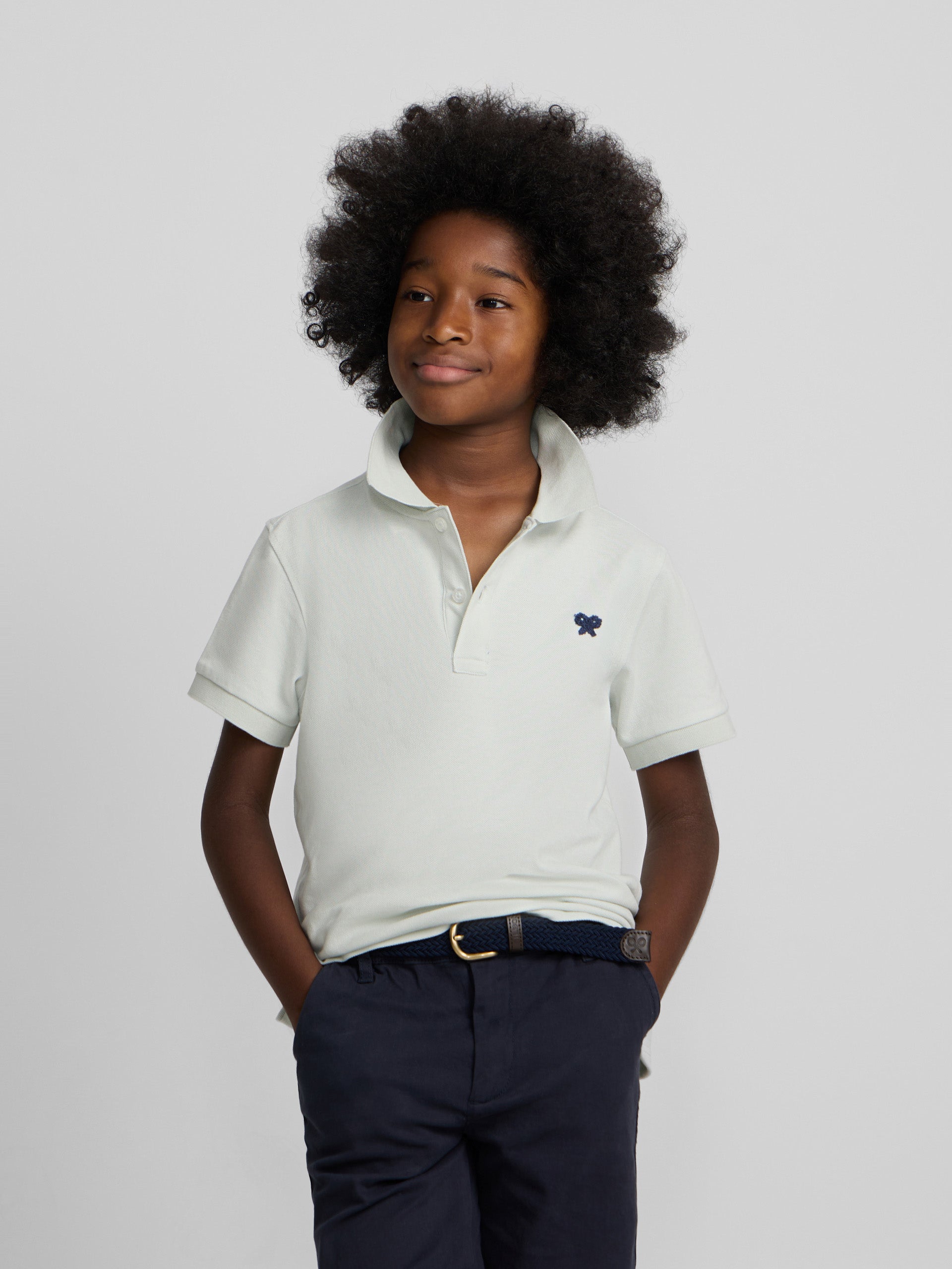 Polo enfant uni logo bouclé vert clair