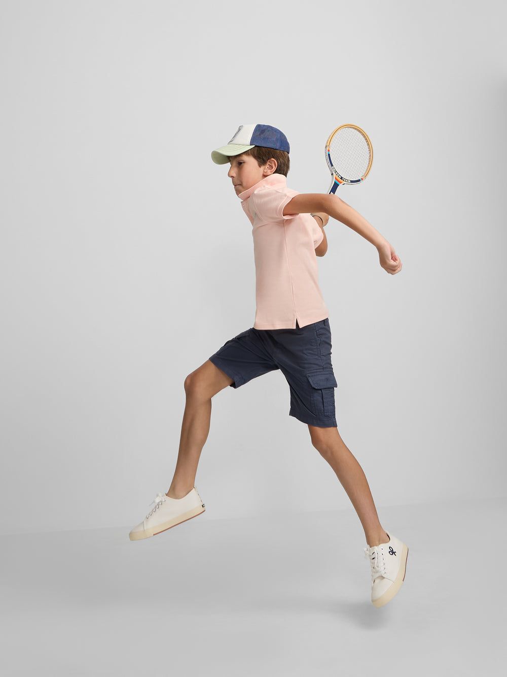 Polo enfant uni logo bouclé corail