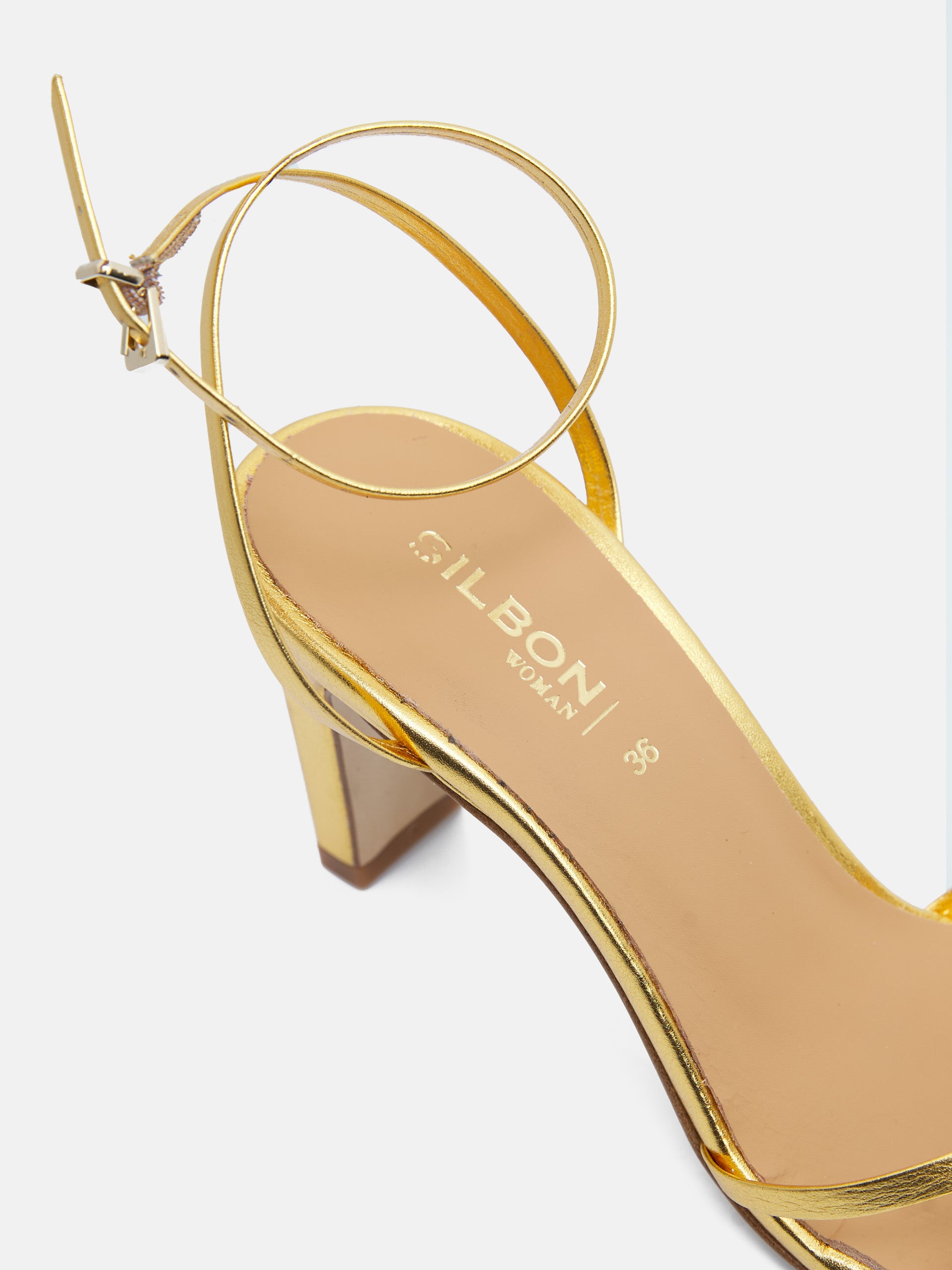 Heeled sandal with golden straps